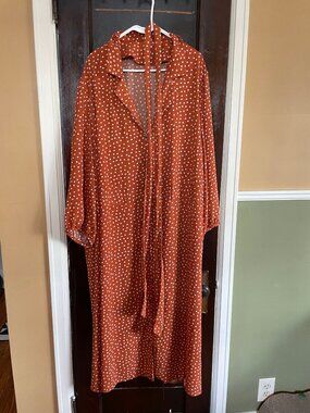 Burnt orange belted polka dot maxi dress with three-quarter sleeves